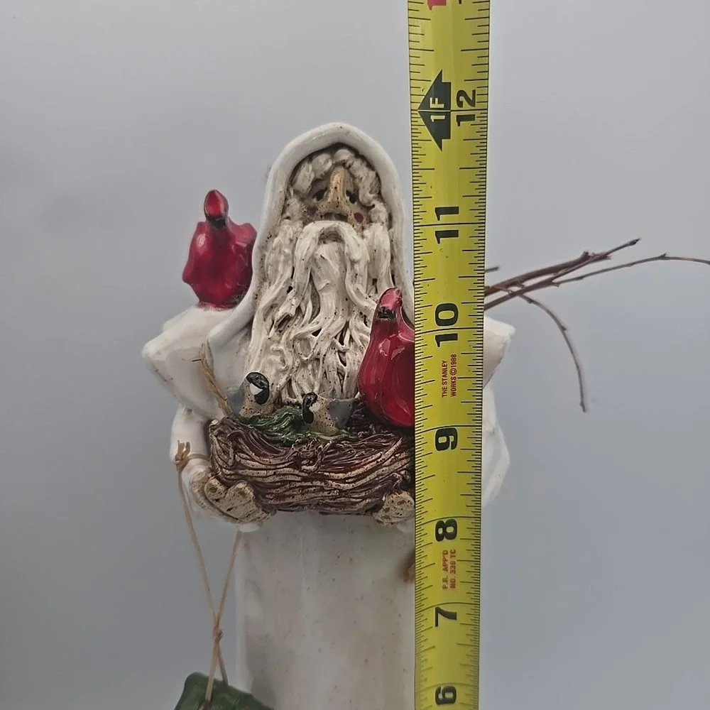 Tall White Coat‎ Santa Holding Cardinals And Bird Nest